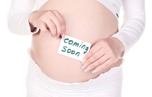 Uma mulher grávida loira em pano branco com arco vermelho e nota "de Deus" em uma colisão — Fotografia de Stock