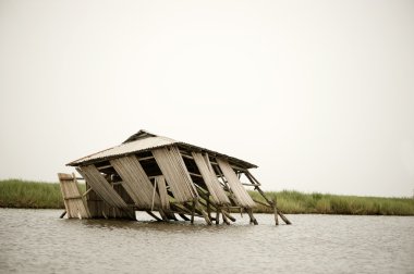 Collapsed stilt house clipart