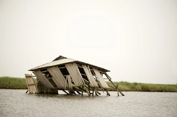 Collapsed stilt house — Stock Photo, Image