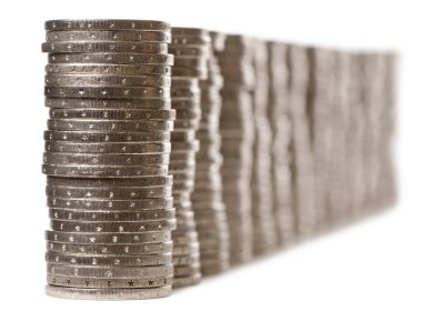 Stacks of 2 Euros Coins in front of white background clipart