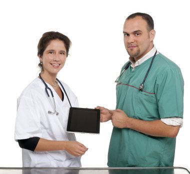 Vets holding a digital tablet clipart