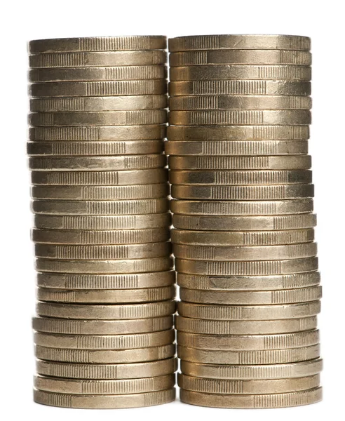 Στοίβες των κερμάτων σε ευρώ 1 μπροστά από το λευκό φόντο — Φωτογραφία Αρχείου