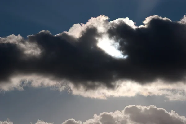 stock image The sky and the sun behind the clouds