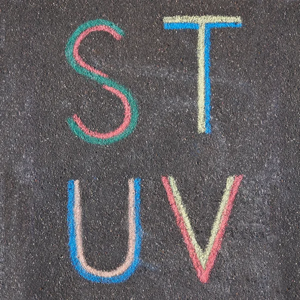 Alphabet letters drawn on asphalt with chalk, s, t, u, v — Stock Photo, Image
