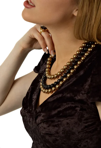 Beautiful woman touching her pearl beads — Stock Photo, Image