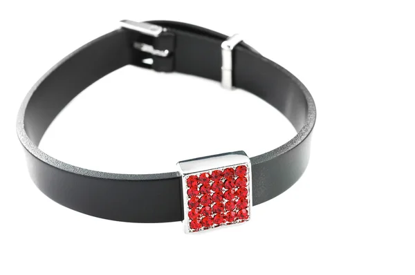 Black rubber bracelet with red crystals isolated on white — Stock Photo, Image