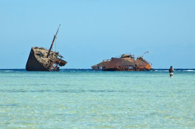 Photo of old rusty ship run aground clipart