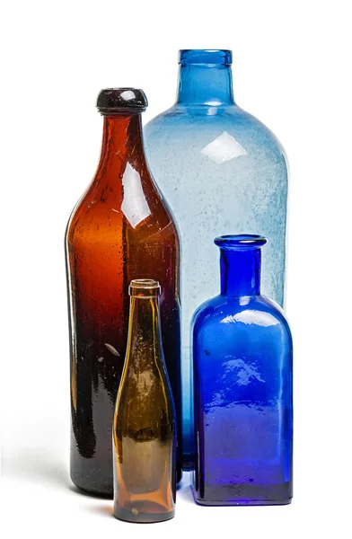 Composição de garrafas velhas azuis e marrons — Fotografia de Stock