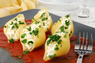 Pasta shells stuffed with cheese clipart