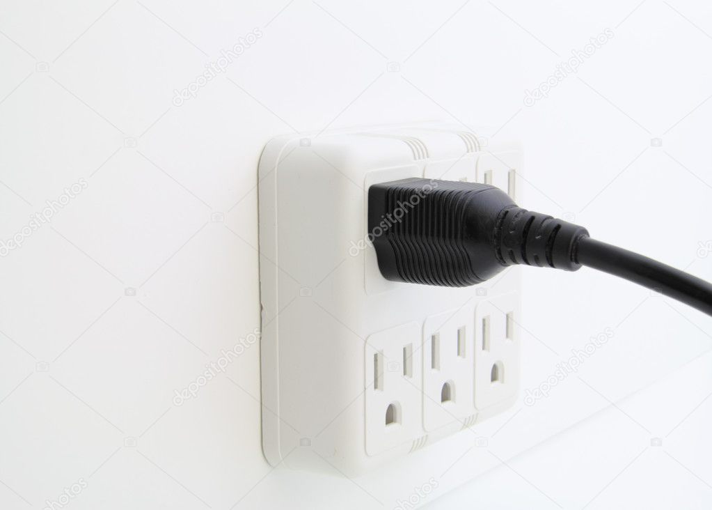 Power cord plugged into wall outlet.