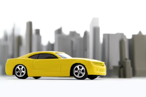 Gele auto in de stad — Stockfoto