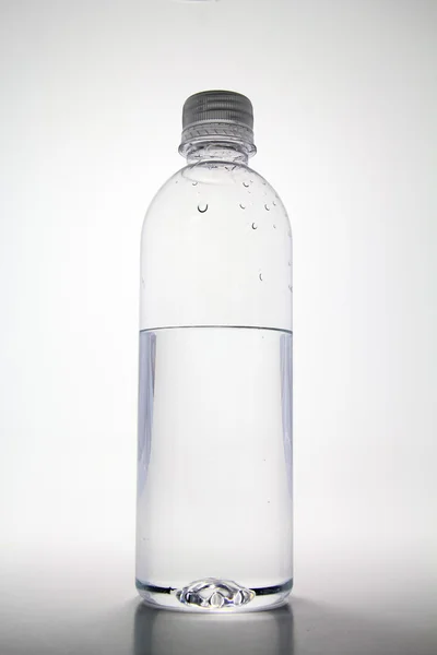 Half empty water bottle. — Stock Photo © Torian #11978067