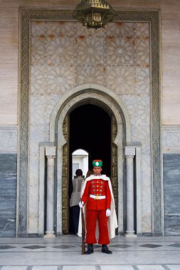 Guard in front of the Mausoleum of Mohamed V in Rabat clipart