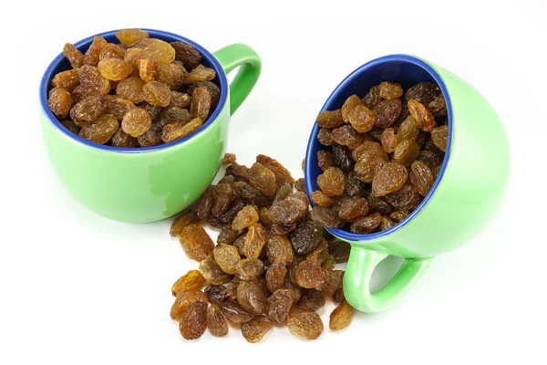 Two coffee cups full of raisins — Stock Photo, Image