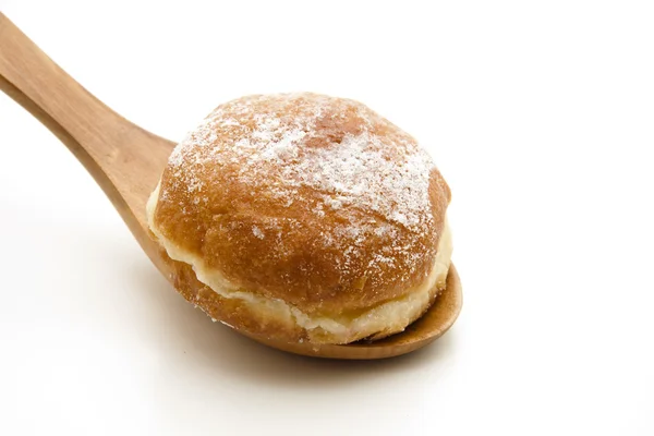 Donuts on wooden spoon — Stock Photo, Image