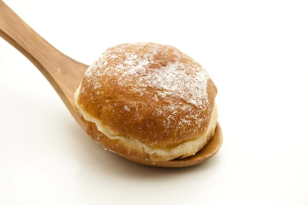 Donuts on wooden spoon — Stock Photo, Image