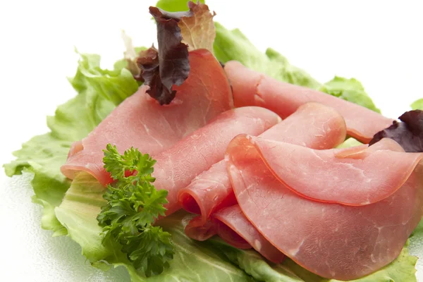 Ham with parsley garnishes — Stock Photo, Image