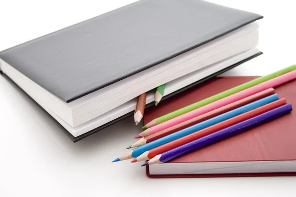 Lápices y libros de colores — Foto de Stock