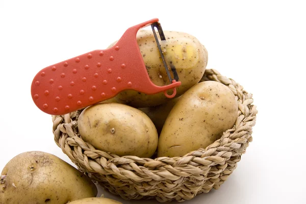 Raw potatoes with knife — Stock Photo, Image