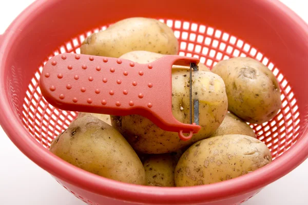 Potatoes in the culinary sieve — Stock Photo, Image