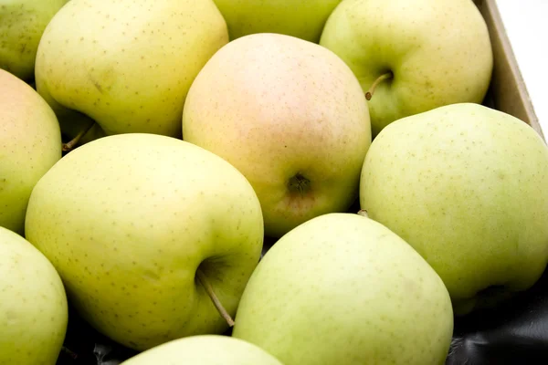 Green apples in the cardboard — Stock Photo, Image