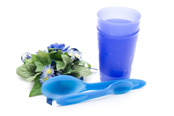 Drinking mug with plastic silverware — Stock Photo, Image