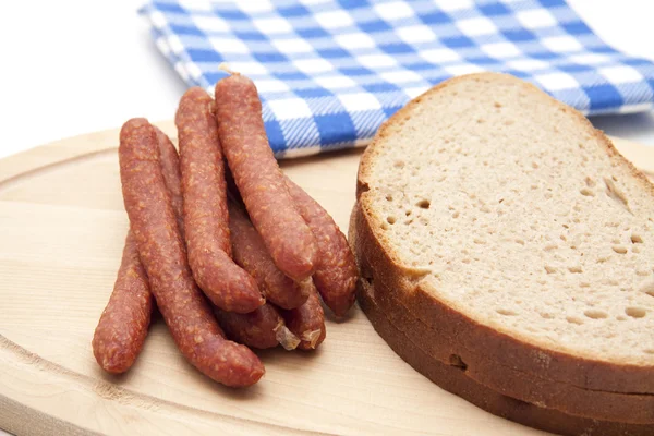 Bologne sausage with bread and napkin — Stock Photo, Image