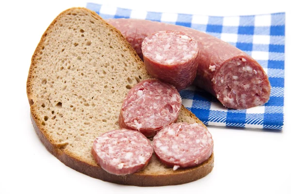 Garlic salami with bread and napkin — Stock Photo, Image