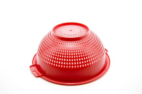 Red culinary sieve of plastic — Stock Photo, Image