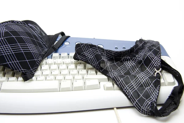 Brassiere and underpants on keyboard — Stock Photo, Image
