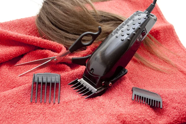 Black electric clippers with red towel — Stock Photo, Image