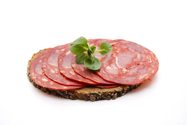 Spanish salamis on bread — Stock Photo, Image