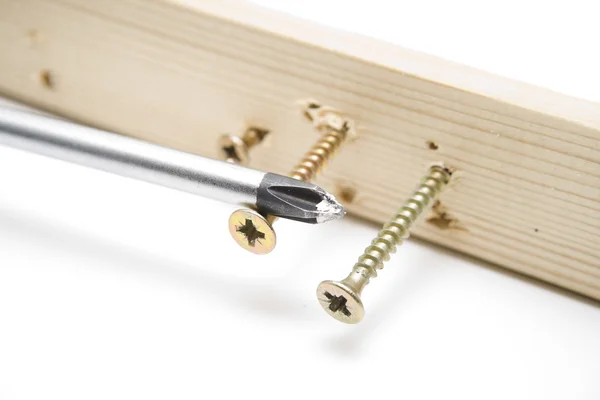 Screwdriver with Screws in Wood — Stock Photo, Image