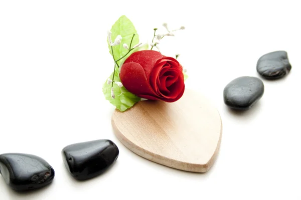 Black stones with rose — Stock Photo, Image