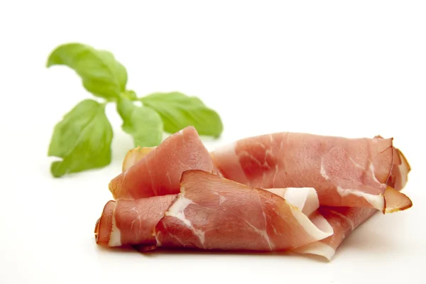 Raw ham with basil — Stock Photo, Image