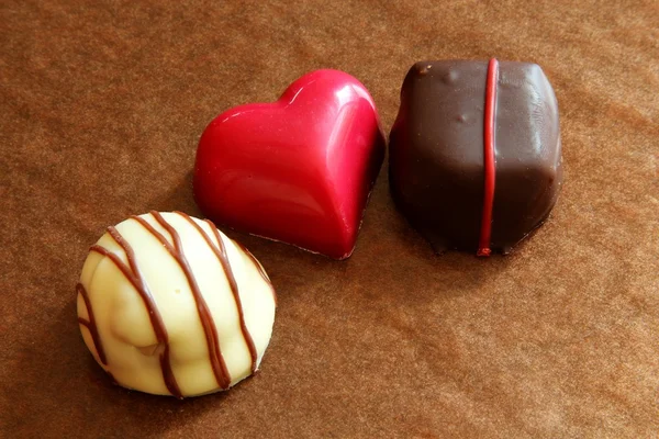 Three chocolates — Stock Photo, Image