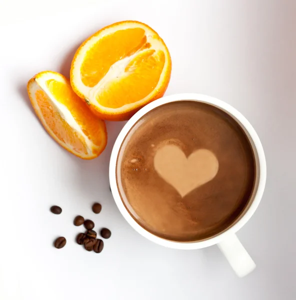 stock image Coffee with a heart symbol, coffee grains and orange