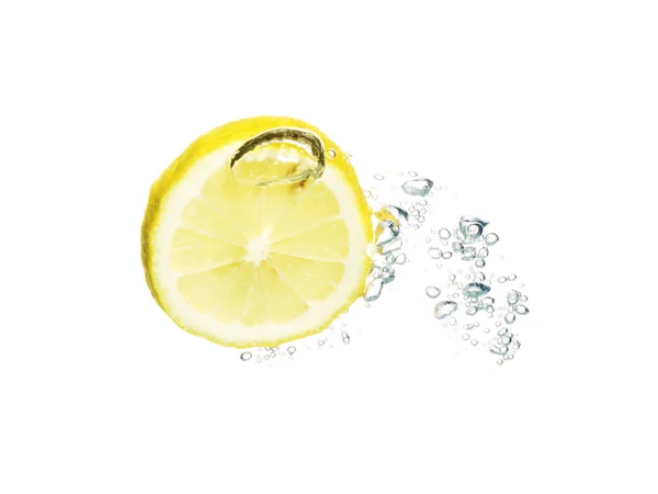 Lemon in the water with bubbles — Stock Photo, Image