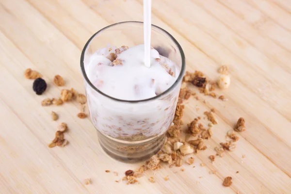 Natural yogurt with muesli in small glass — Stock Photo, Image