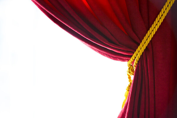A red curtain folded and a white background.