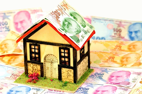 stock image Miniature house and money