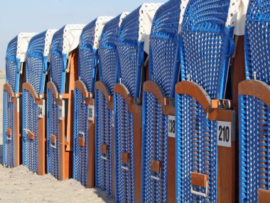 Canopied beach chairs at the beach of Warnemünde (Germany) 02