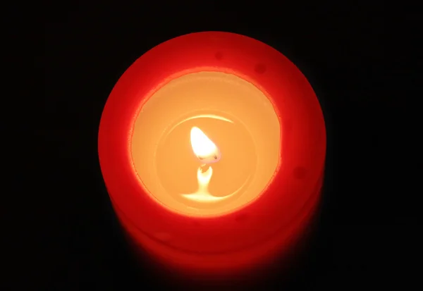 Red candle with black background — Stock Photo, Image