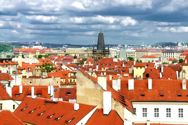 Prague roofs and cloudy sky — Stock Photo, Image