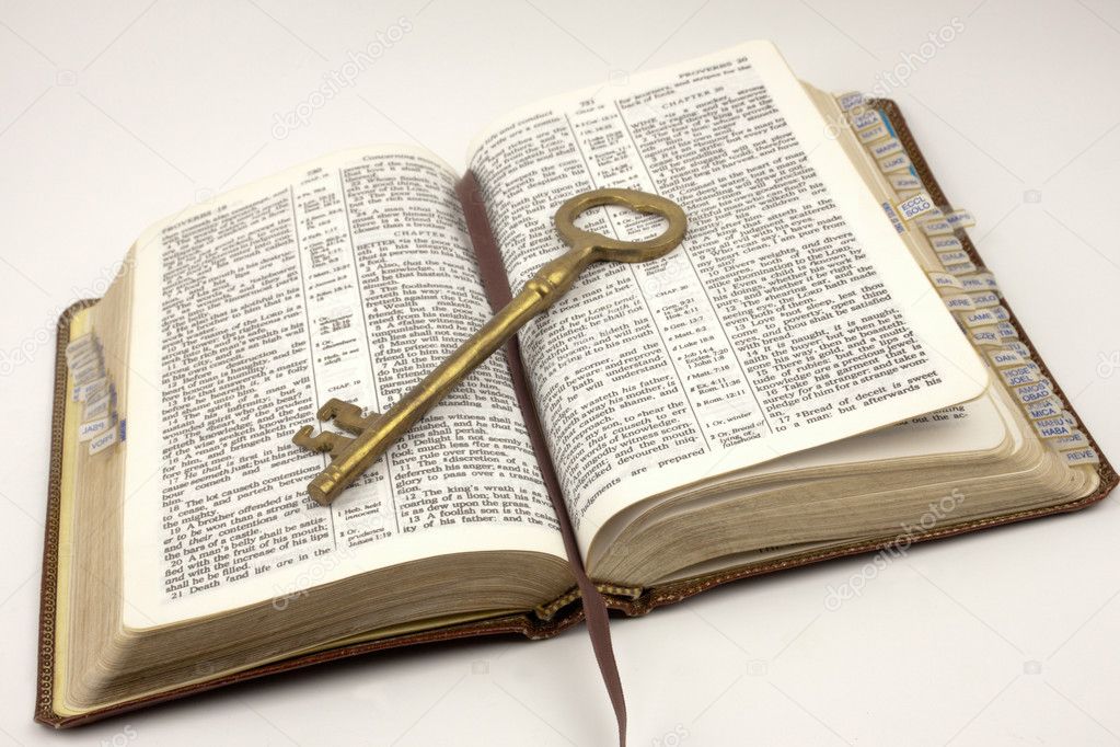 Opened Bible With Golden Key