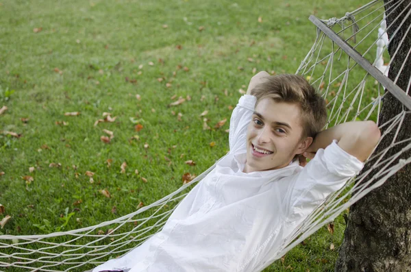 Young man in a hammock — Stock Photo, Image