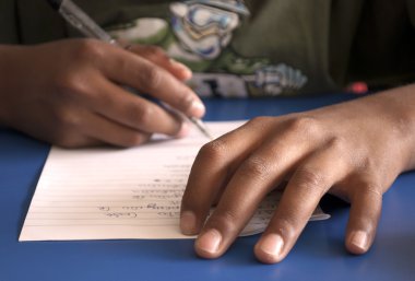 Student's hands with pen clipart