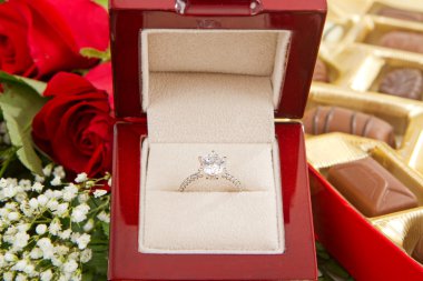 Engagement Ring With Chocolates and Roses clipart