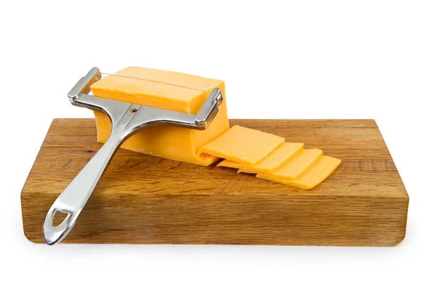 Cheddar Cheese on a Cutting Board — Stock Photo, Image