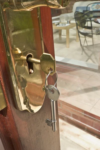 A key in door illustrating security — Stock Photo, Image